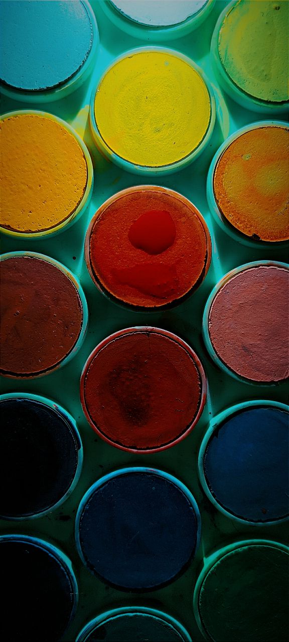 a group of colorful paint cans